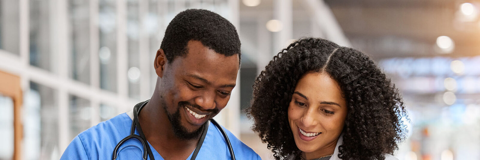 Nurse and physician reviewing chart on tablet