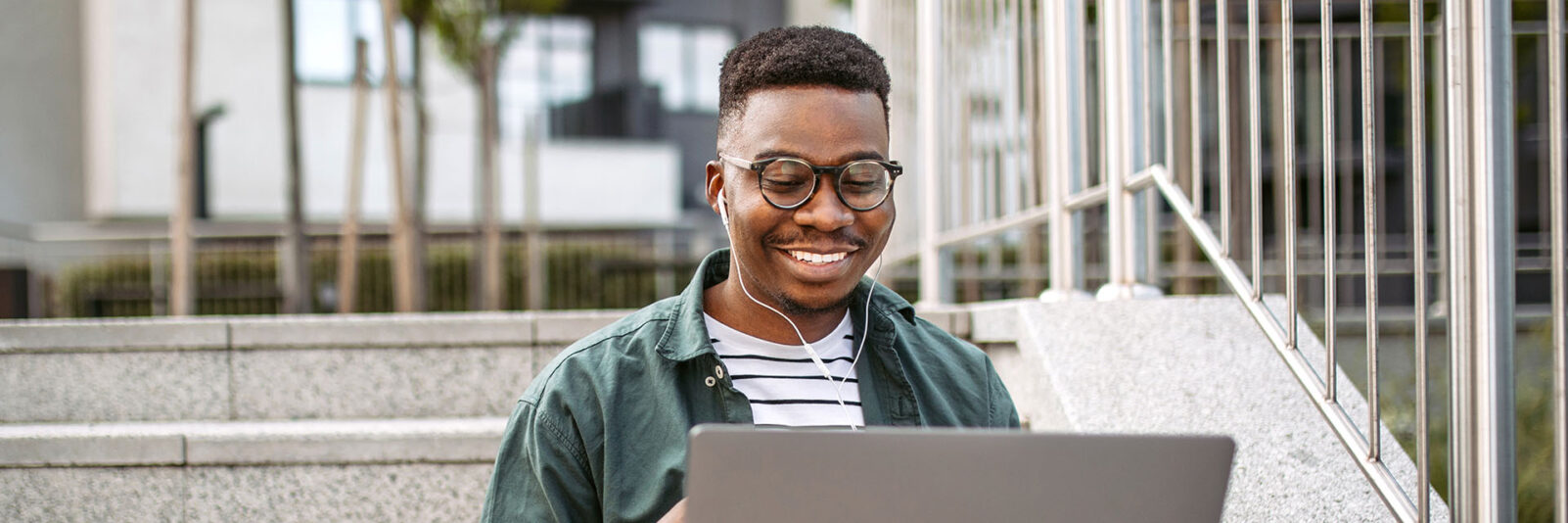 student on university steps studying