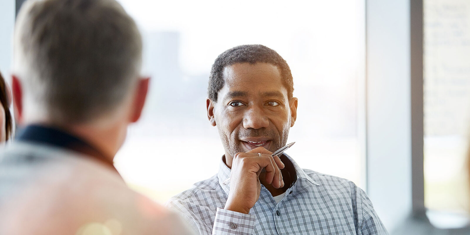 Man in meeting with client