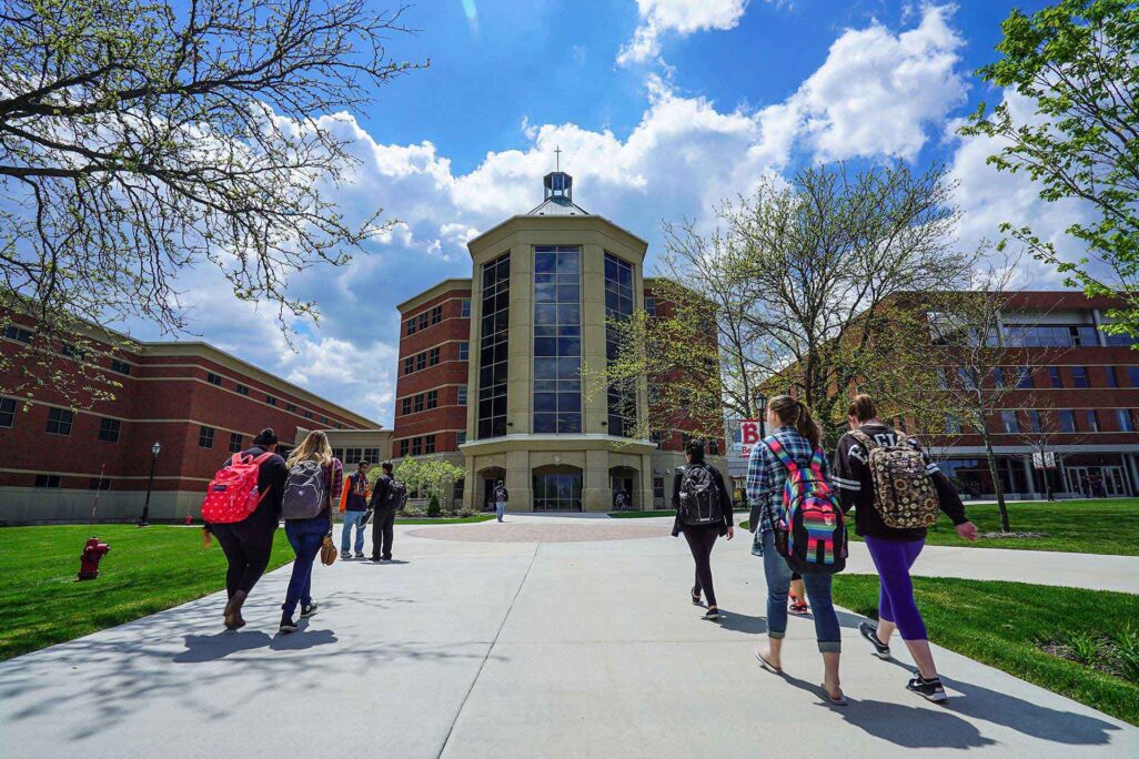 bdt-about-hero Students walking outside Benedictine University main campus